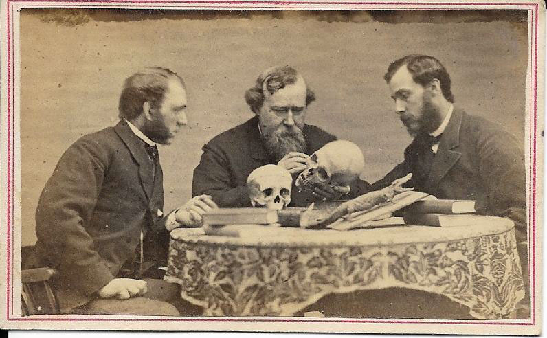 Crania scientists (3 men with skulls)