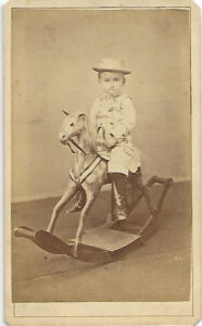 Boy on Toy Rocking Horse
