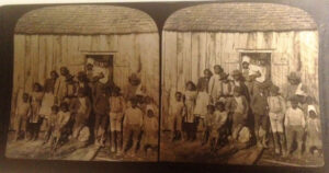 Enslaved Family Outside of Cabin