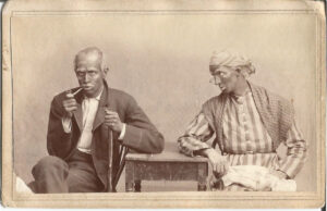 Two Seated at Table in Blackface