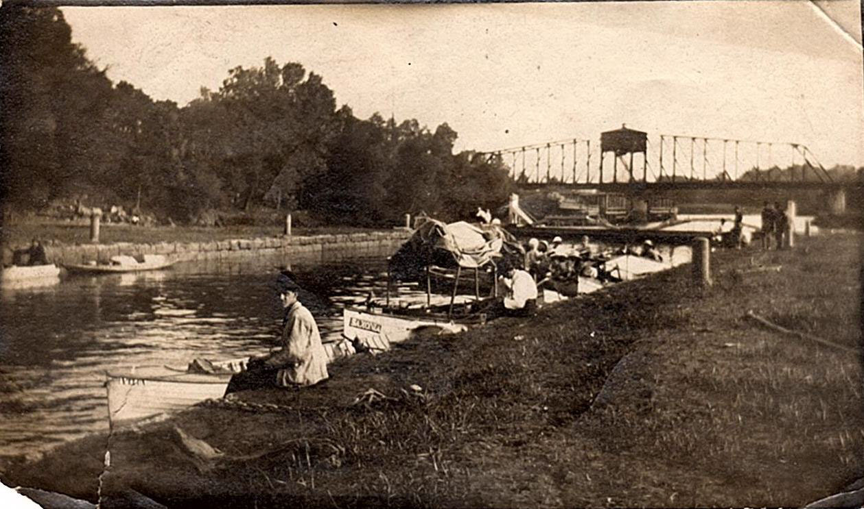 Canal with People Along Shore