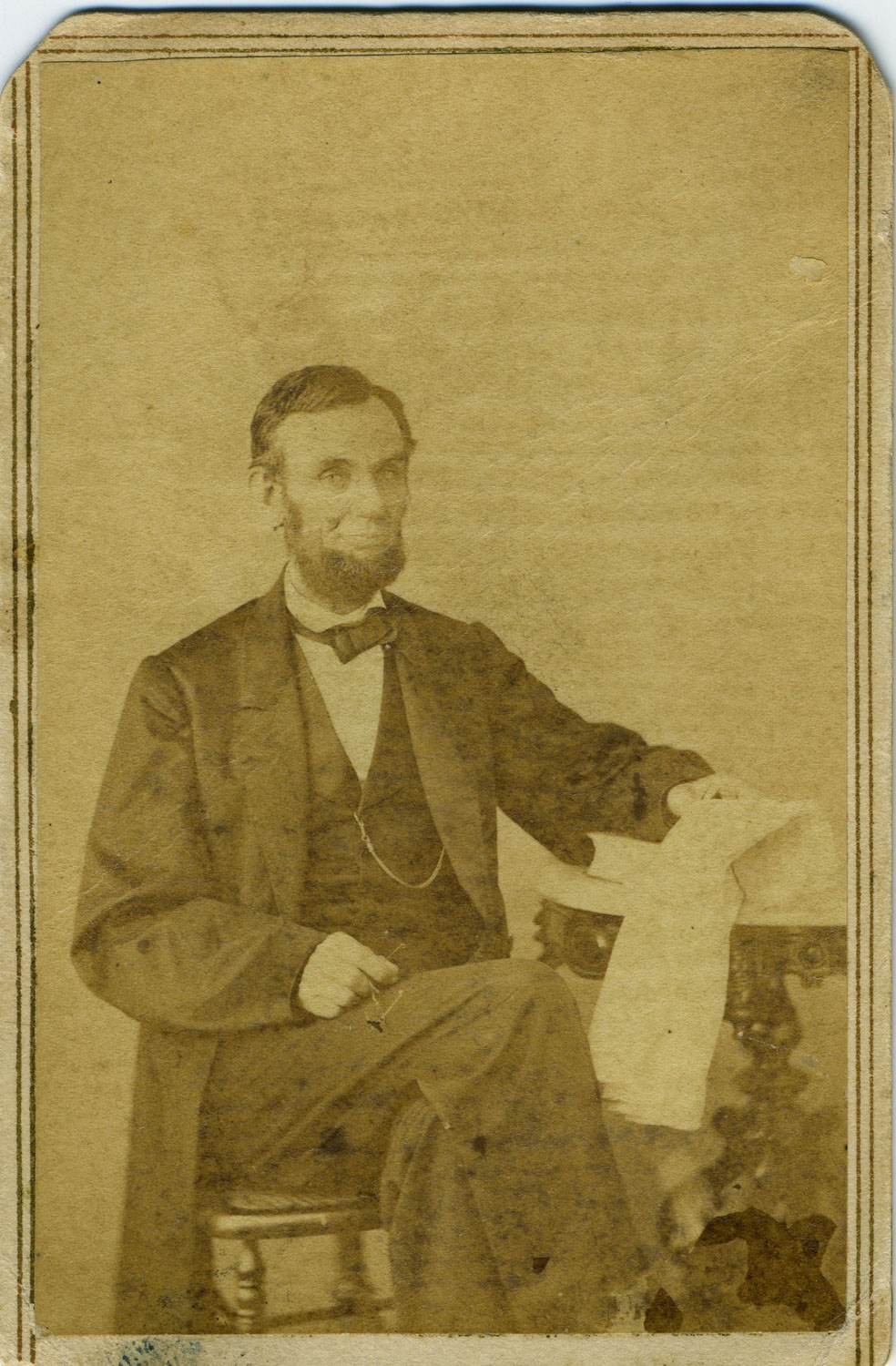 Lincoln Seated with Newspaper