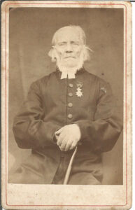 Old Man with Medal and Cane